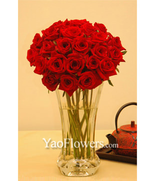 Two Dozen Red Roses With a Vase