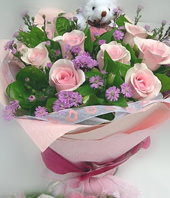 11 Pink roses and A bear