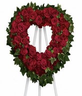Red roses,spray roses,carnations.23 W x 24 H. Easel not included