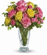 Yellow and light pink roses, pink spray roses and fresh greenery. Approximately 13