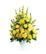 classic funeral arrangement in yellow