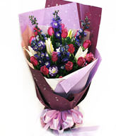 15 purple roses , lilies , delphinium