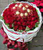 50 red roses and Ferrero Rocher 12 yarn packages . White flowers