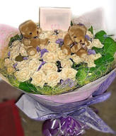 33 champagne roses ,lavenders ,two bears