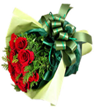 A bouquet of 12 red roses with green foliages