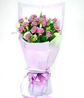 19 purple roses with some gardenia and aspidistra