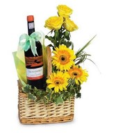 Red Wine & Arrangement of yellow roses and gerberas