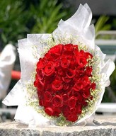99 stalks of red roses with baby's breath