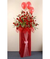 Red Roses, Baby's Breath , Eucalyptus And Balloons On A Red Box Stand 