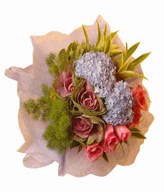 Purple cabbage, hydrangeas , pink roses with song of india in purple wrapping