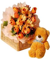 Tulips, gerberas and hypericum with bear