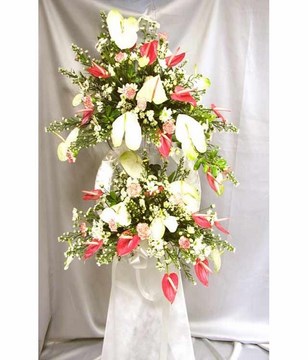Flower arrangement of daisies, pompoms and orchids