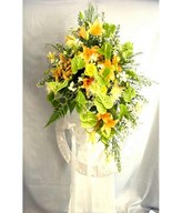 Floral arrangement of lilies and anthuriums