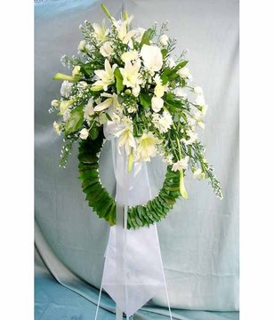 Funeral stand with lilies and roses
