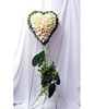 Heart-shaped floral arrangement of pastel roses